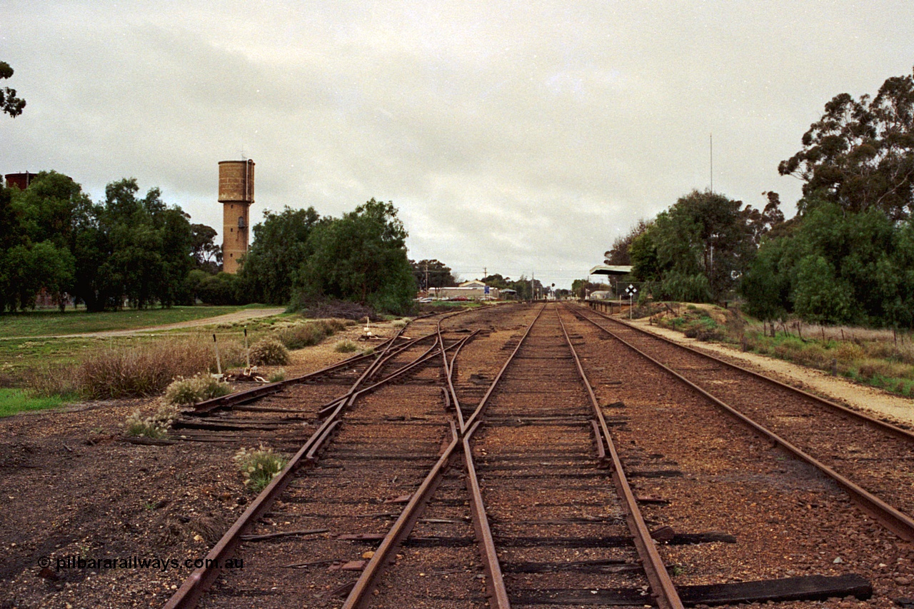108-35
Kyabram station yard overview north end, looking south, tracks removed, station building at right.
