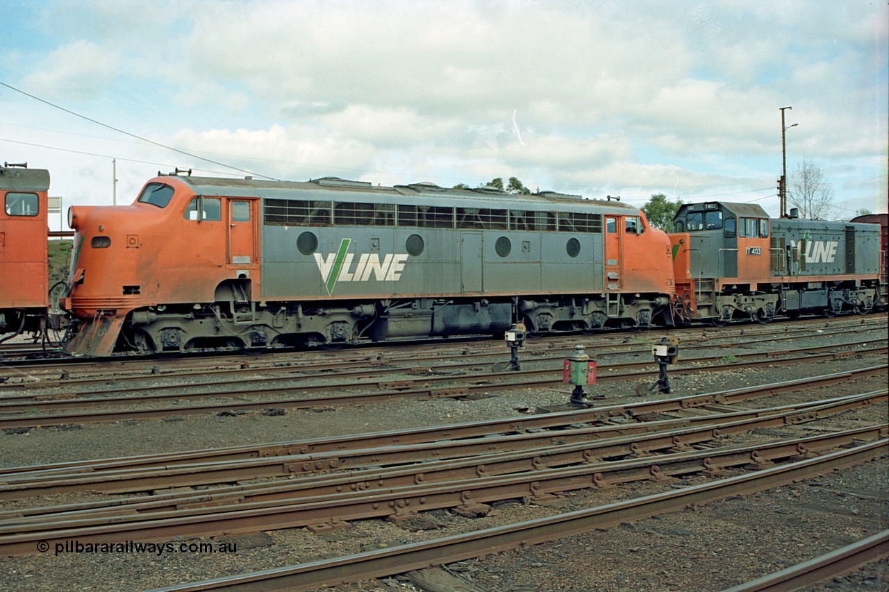 110-04
Benalla yard view, broad gauge V/Line B class B 64 Clyde Engineering EMD model ML2 serial ML2-5 and V/Line T class loco T 403 with serial 67-498 a Clyde Engineering Granville NSW built EMD model G18B, stabled down Wodonga goods train 9303, point indicators and ground disc signals.
Keywords: B-class;B64;Clyde-Engineering-Granville-NSW;EMD;ML2;ML2-5;bulldog;T-class;T403;G18B;67-498;