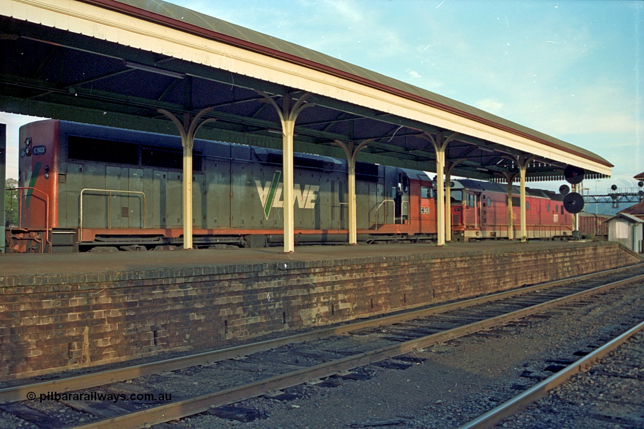 110-21
Albury station platform, V/Line standard gauge C class C 503 Clyde Engineering EMD model GT26C serial 76-826 and NSWSRA 81 class 8171 Clyde Engineering EMD model JT26C-2SS serial 85-1090 on an up goods train on the standard gauge side, V/Line broad gauge tracks in the foreground.
Keywords: C-class;C503;Clyde-Engineering-Rosewater-SA;EMD;GT26C;76-826;81-class;8171;JT26C-2SS;85-1090;