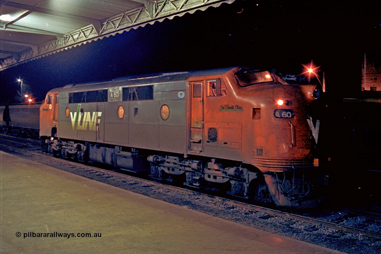 110-27
Seymour station platform, V/Line broad gauge A class locomotive A 60 'Sir Harold Clapp' Clyde Engineering EMD model AAT22C-2R serial 84-1184 rebuilt from B 60 'Sir Harold Clapp' Clyde Engineering EMD model ML2 serial ML2-1 waiting to run the Sunday evening down Cobram passenger train 8345.
Keywords: A-class;A60;Clyde-Engineering-Rosewater-SA;EMD;AAT22C-2R;84-1184;rebuild;bulldog;