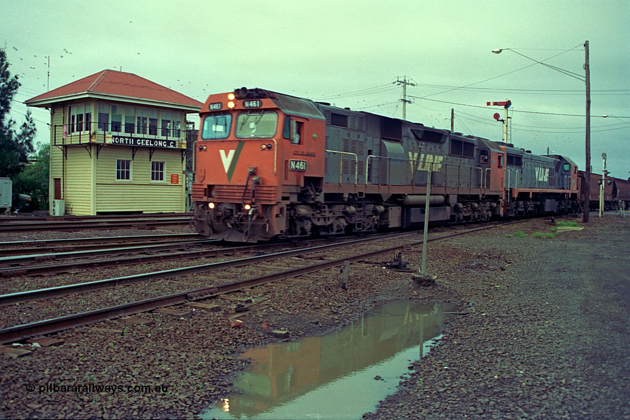 111-04
North Geelong C Box, V/Line broad gauge locos N class N 461 'City of Ararat' Clyde Engineering EMD model JT22HC-2 serial 86-1190 and X class X 47 Clyde Engineering EMD model G26C serial 75-794 head down the grain loop line, signal box, semaphore signal post, the line in the foreground is the Loop Line to Melbourne.
Keywords: N-class;N461;Clyde-Engineering-Somerton-Victoria;EMD;JT22HC-2;86-1190;