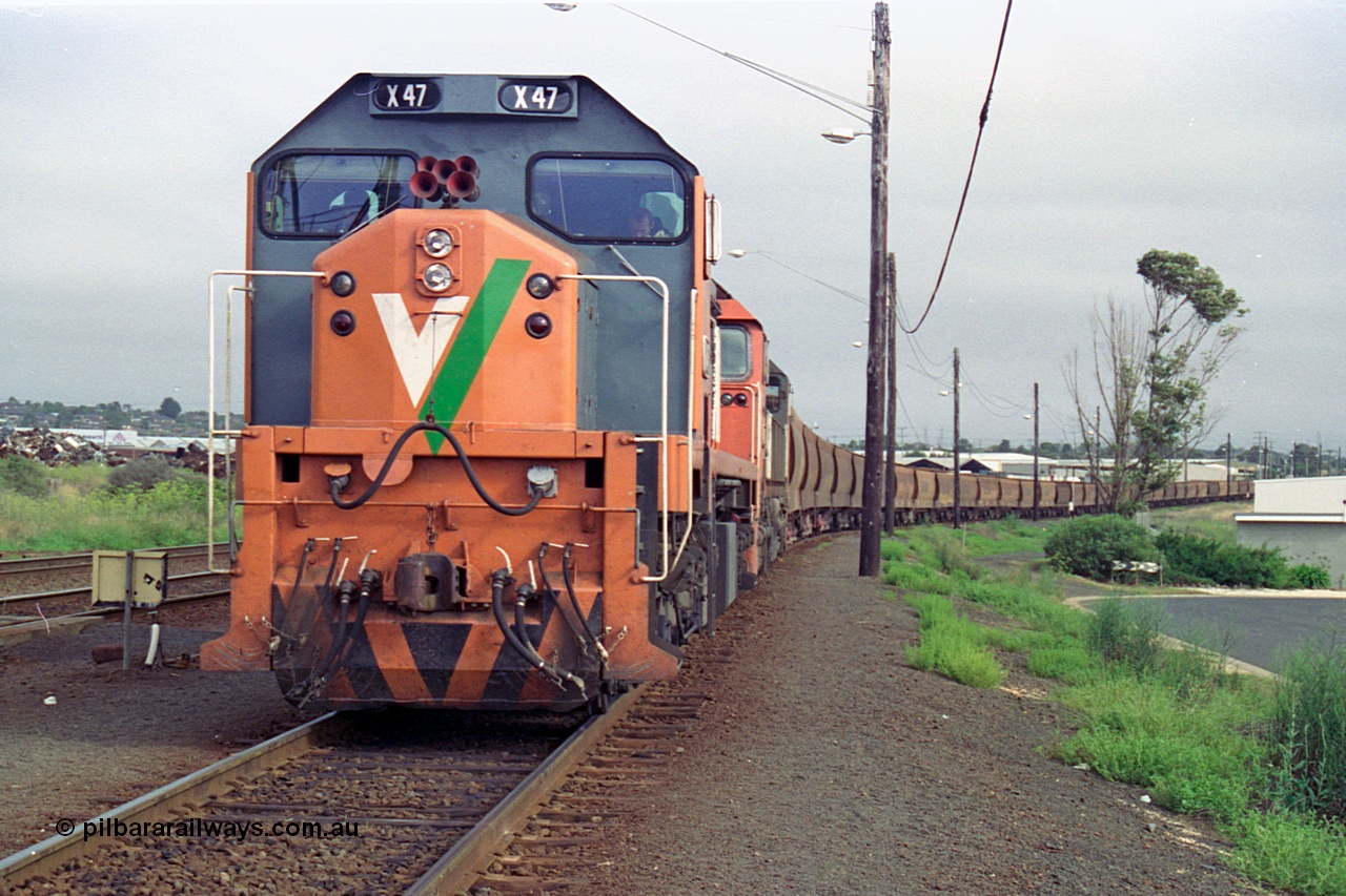 111-16
North Geelong grain arrivals yard, V/Line broad gauge loco X class X 47 Clyde Engineering EMD model G26C serial 75-794 and N class N 461 'City of Ararat' Clyde Engineering EMD model JT22HC-2 serial 86-1190 with a loaded grain loop have their crib break before heading back to the grain loop.
Keywords: X-class;X47;Clyde-Engineering-Rosewater-SA;EMD;G26C;75-794;