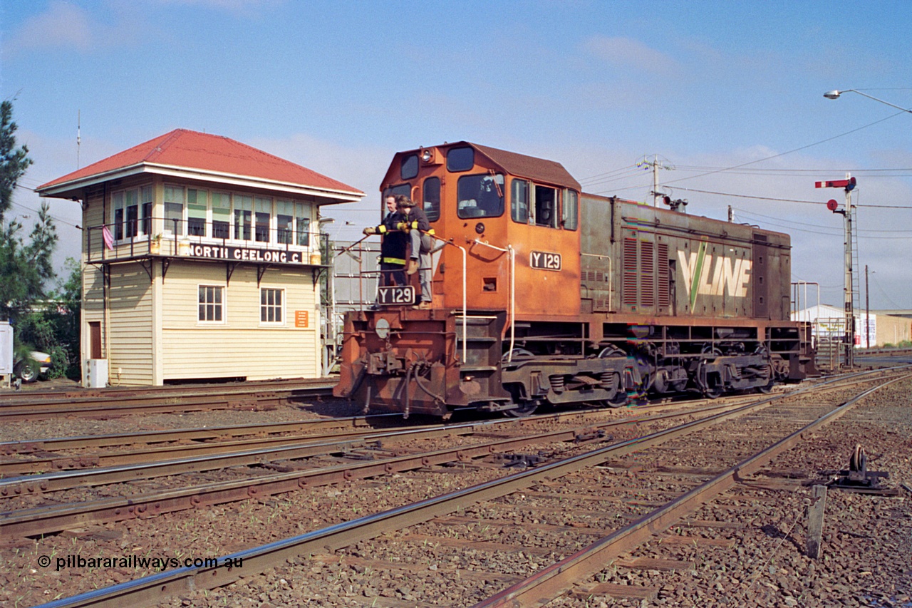 111-19
North Geelong C Box, V/Line broad gauge shunt loco Y class Y 129 Clyde Engineering EMD model G6B serial 65-395 runs back into Geelong Yard light engine from the arrivals, shunters on loco, framed by signal box and signal post 16.
Keywords: Y-class;Y129;Clyde-Engineering-Granville-NSW;EMD;G6B;65-395;