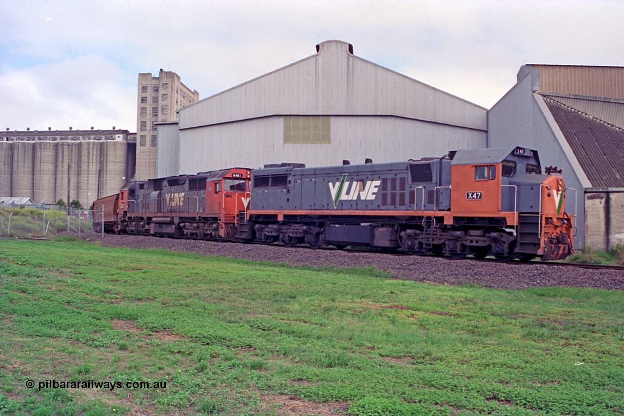 111-22
North Geelong grain loop, V/Line broad gauge locos X class X 47 Clyde Engineering EMD model G26C serial 75-794 and N class N 461 'City of Ararat' Clyde Engineering EMD model JT22HC-2 serial 86-1190 unload their train, grain complex behind locos.
Keywords: X-class;X47;Clyde-Engineering-Rosewater-SA;EMD;G26C;75-794;