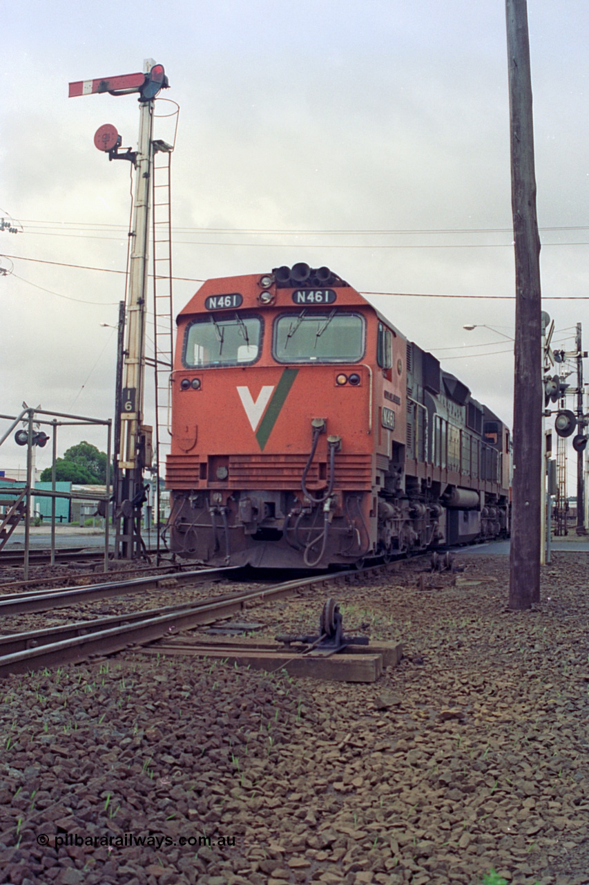 111-26
North Geelong C Box, V/Line broad gauge locomotives N class N 461 'City of Ararat' Clyde Engineering EMD model JT22HC-2 serial 86-1190 with X class X 47 Clyde Engineering EMD model G26C serial 75-794 run past semaphore signal post 16 with another loaded grain train from the grain arrival roads bound for the grain loop.
Keywords: N-class;N461;Clyde-Engineering-Somerton-Victoria;EMD;JT22HC-2;86-1190;
