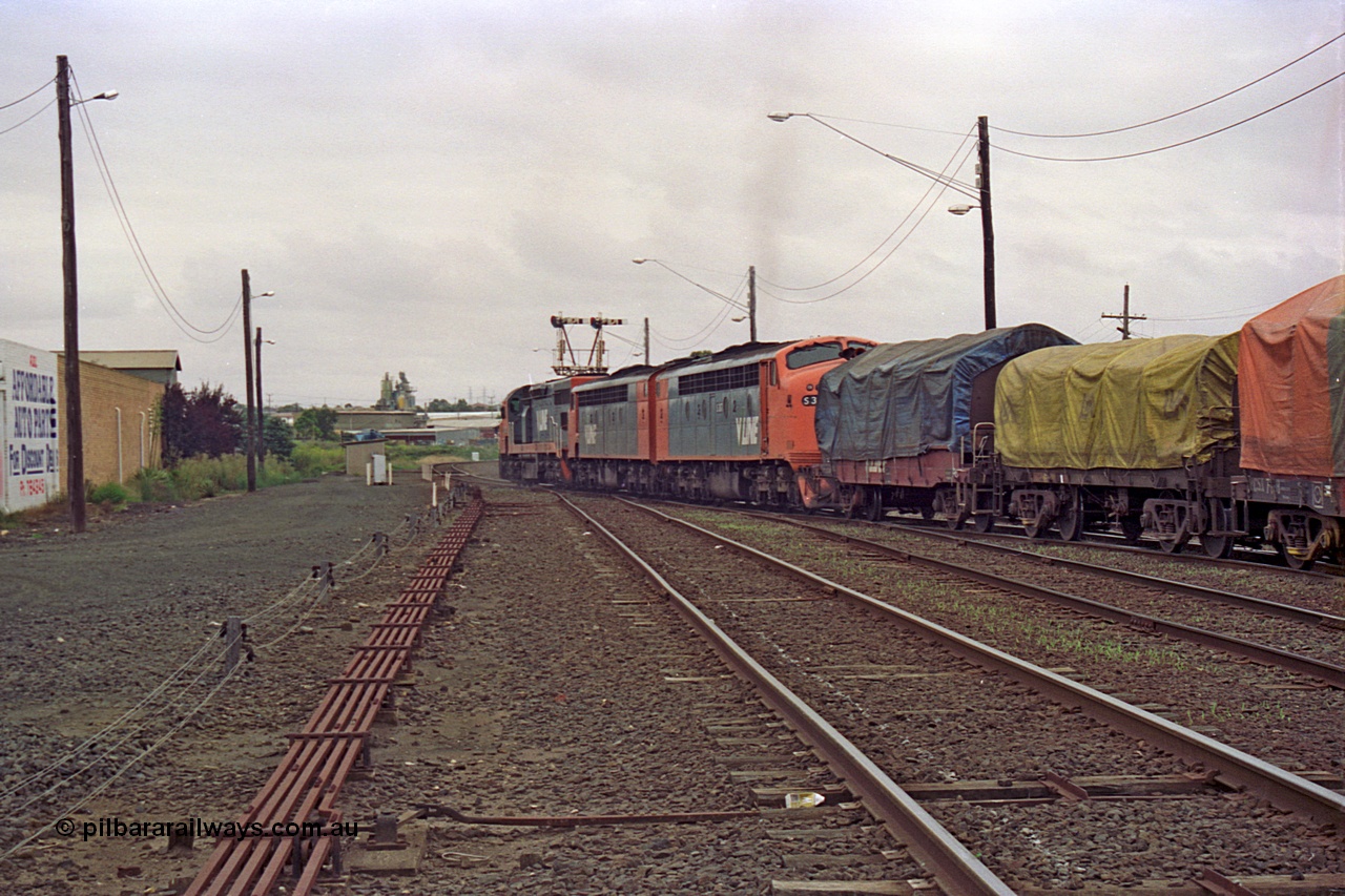 111-33
North Geelong C Box, V/Line down broad gauge goods train 9169 to Adelaide via Cressy with C class C 508 Clyde Engineering EMD model GT26C serial 76-831, S class S 307 'John Pascoe Fawkner' Clyde Engineering EMD model A7 serial 57-171 and S 317 'Sir John Monash' serial 61-240 powers west past the grain arrivals, VSCX type bogie coil steel waggon.
Keywords: C-class;C508;Clyde-Engineering-Rosewater-SA;EMD;GT26C;76-831;
