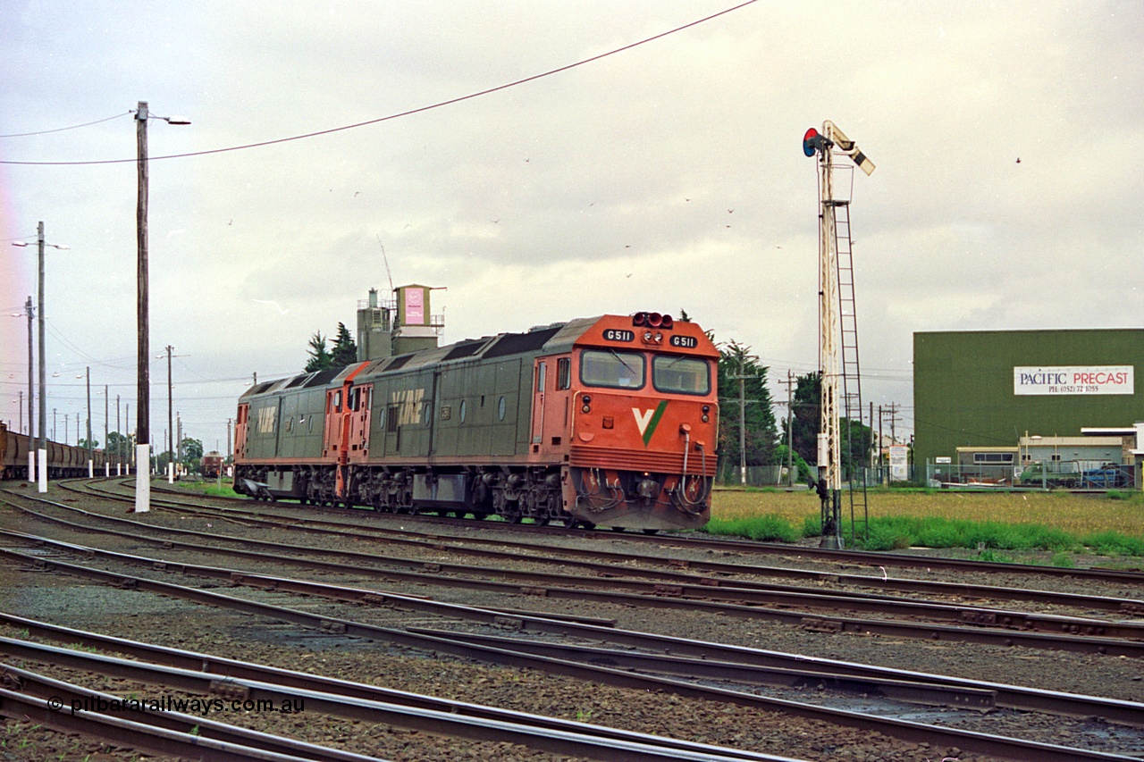 111-34
North Geelong yard, V/Line broad gauge light engines Series 1 G class leader G 511 Clyde Engineering EMD model JT26C-2SS serial 84-1239 and G 538 Clyde Engineering EMD model JT26C-2SS serial 89-1271 arrive at semaphore signal post 17 from Geelong loco depot destined for empty grain train 9123, track and yard view.
Keywords: G-class;G511;Clyde-Engineering-Rosewater-SA;EMD;JT26C-2SS;84-1239;