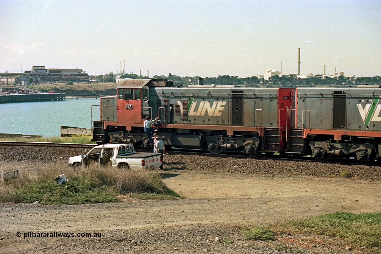 112-26
North Geelong grain loop, V/Line broad gauge H class H 2 Clyde Engineering EMD model G18B serial 68-630, LHS view coupled to sister H 5 serial 68-632, grain loop unloading operations, crew change taking effect.
Keywords: H-class;H2;Clyde-Engineering-Granville-NSW;EMD;G18B;68-630;H5;68-632;