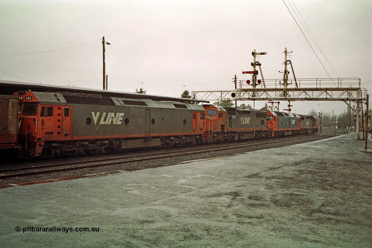 113-03
Ballarat station platform No.2, signal gantry with stripped doll, V/Line broad gauge up Adelaide goods train 9150 behind the quad CGCG combo of C class C 506 Clyde Engineering EMD model GT26C serial 76-829, G class G 538 Clyde Engineering EMD model JT26C-2SS serial 89-1271, C class C 510 serial 76-833 and G class G 513 serial 85-1241, in miserable conditions, poor quality.
Keywords: G-class;G513;Clyde-Engineering-Rosewater-SA;EMD;JT26C-2SS;85-1241;