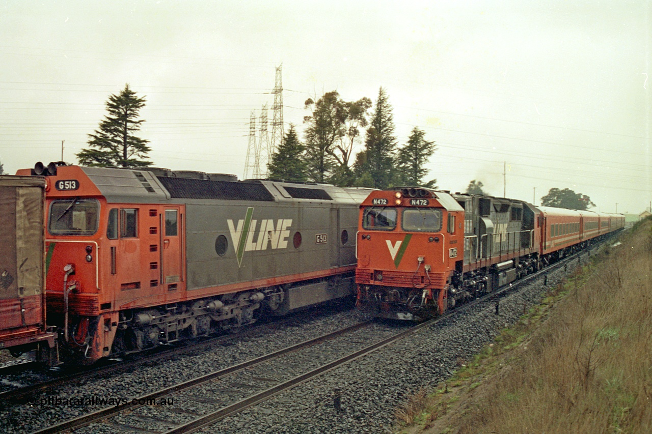 113-09
Warrenheip, V/Line broad gauge up Adelaide goods train 9150 with forth unit visible G class G 513 Clyde Engineering EMD model JT26C-2SS serial 85-1241, is crossed by down passenger train hauled by N class N 472 'City of Sale' Clyde Engineering EMD model JT22HC-2 serial 87-1201 and a double N set, in miserable conditions, poor quality.
Keywords: N-class;N472;Clyde-Engineering-Somerton-Victoria;EMD;JT22HC-2;87-1201;