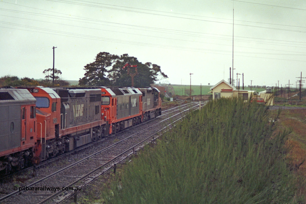 113-11
Warrenheip, V/Line broad gauge up Adelaide goods train 9150 behind the quad CGCG combo of C class C 506 Clyde Engineering EMD model GT26C serial 76-829, G class G 538 Clyde Engineering EMD model JT26C-2SS serial 89-1271, C 510 serial 76-833 and G 513 serial 85-1241, departing for Melbourne via Bacchus Marsh, semaphore signal post 9 pulled off for move, signal box and overview, in miserable conditions, poor quality.
Keywords: C-class;C510;Clyde-Engineering-Rosewater-SA;EMD;GT26C;76-833;