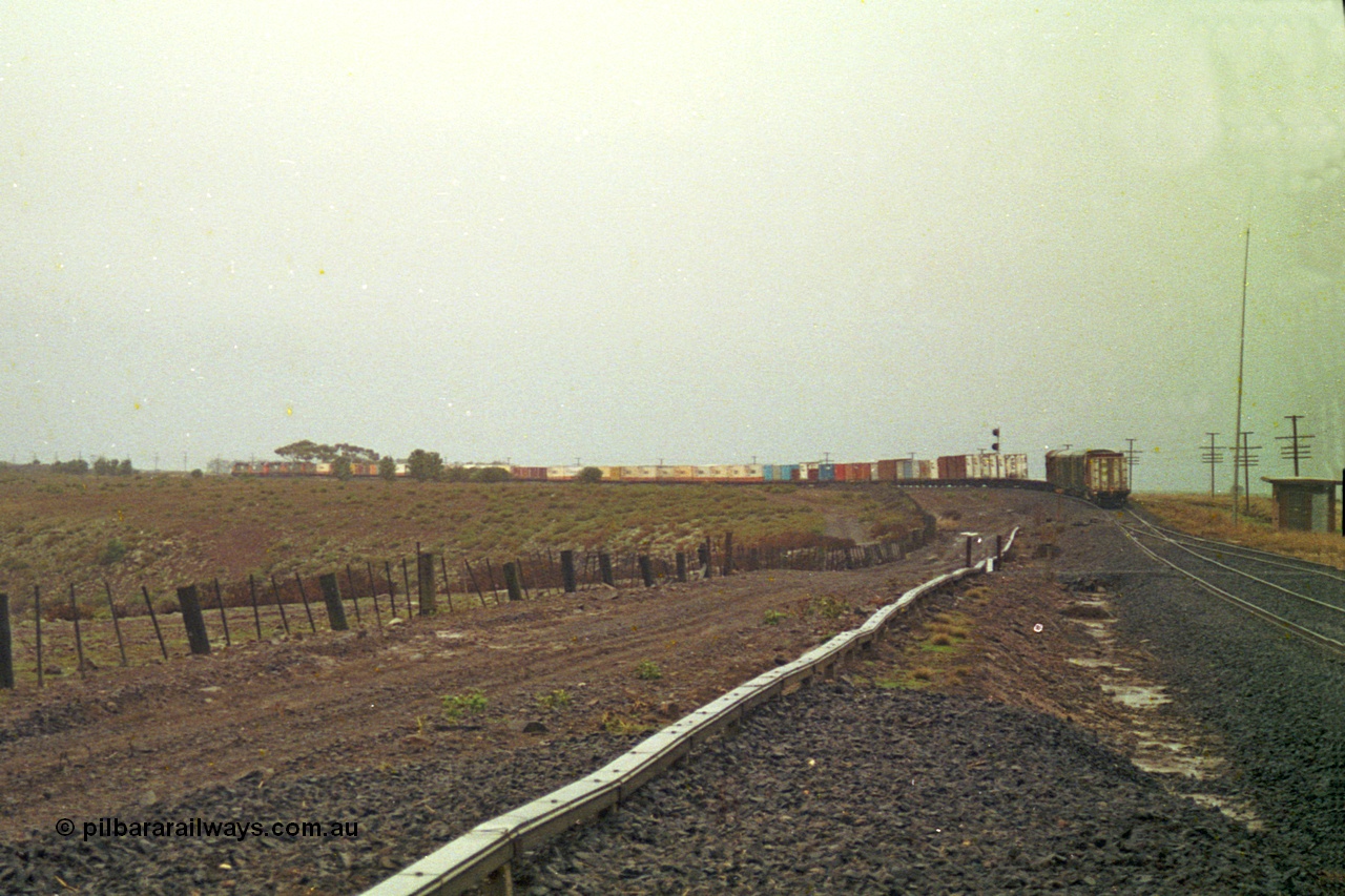 113-17
Bank Box Loop, V/Line train 9150, up Adelaide goods, in miserable conditions, poor quality, distant shot departed.

