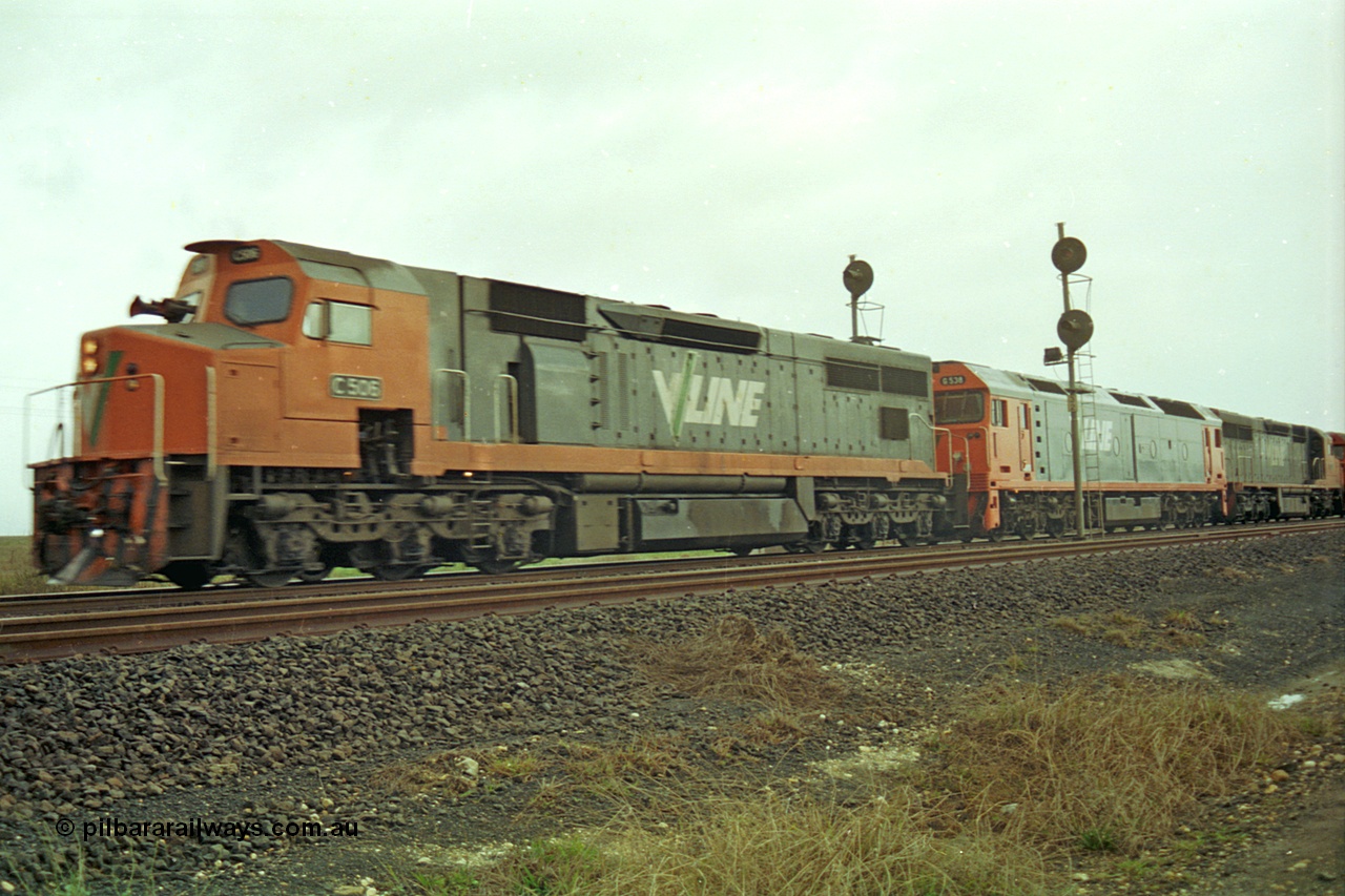 113-19
Parwan Loop, V/Line broad gauge up Adelaide goods train 9150 with C class C 506 Clyde Engineering EMD model GT26C serial 76-829, G class G 538 Clyde Engineering EMD model JT26C-2SS serial 89-1271 and C class C 510 serial 76-833 split the up home signals at the west end of the loop, in miserable conditions, poor quality.
Keywords: C-class;C506;Clyde-Engineering-Rosewater-SA;EMD;GT26C;76-829;