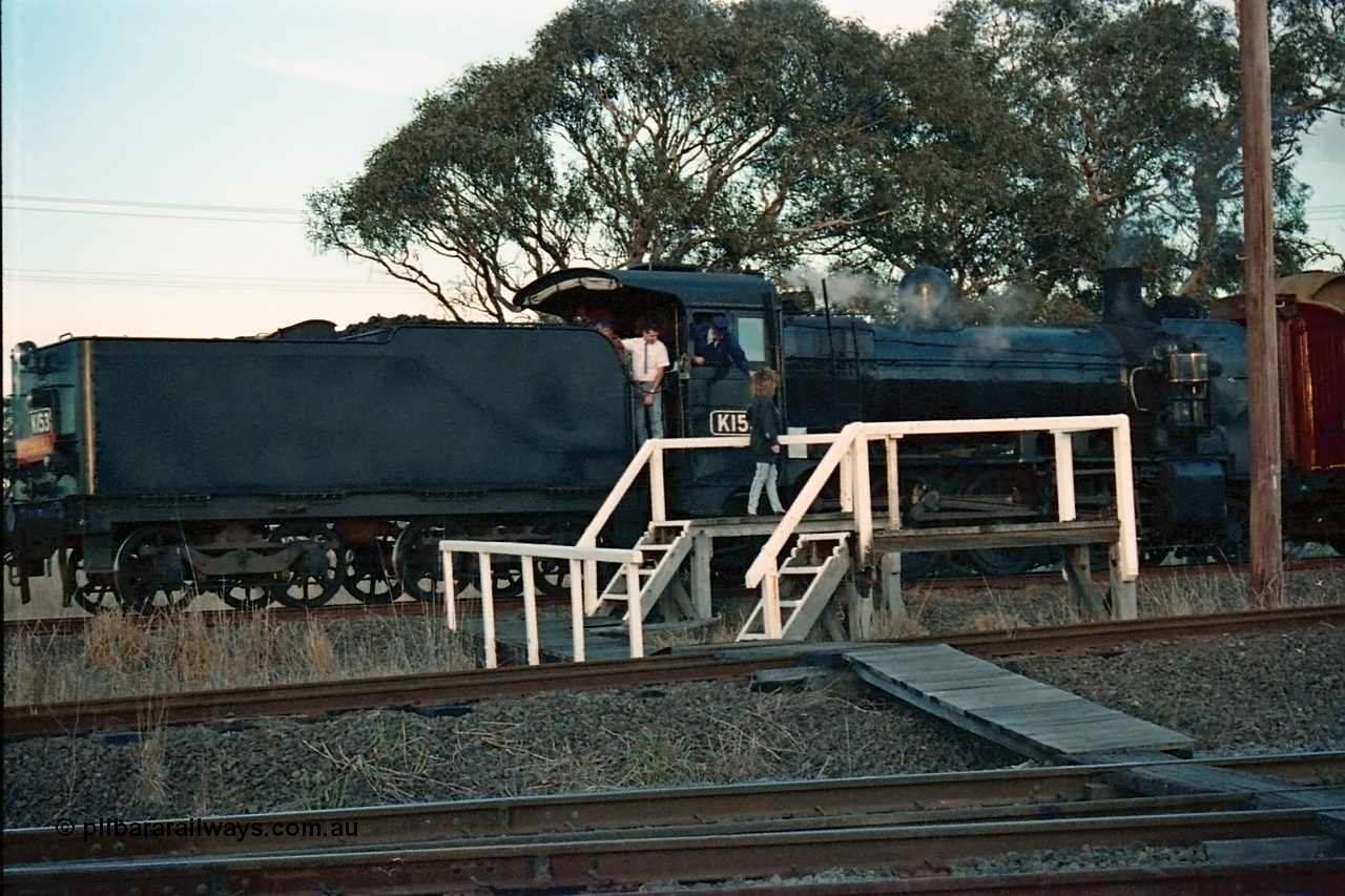 115-15
Somerton, Steamrail broad gauge K class K 153 Victorian Railways built Consolidation model 2-8-0 steam locomotive on the Upfield line surrenders the ordinary train staff to the female signaller with an enthusiasts special, near platform is for the standard gauge line, staff exchange, Steamrail special, looking across the North East running lines.
Keywords: K-class;K153;Victorian-Railways-Newport-WS;Consolidation;2-8-0;