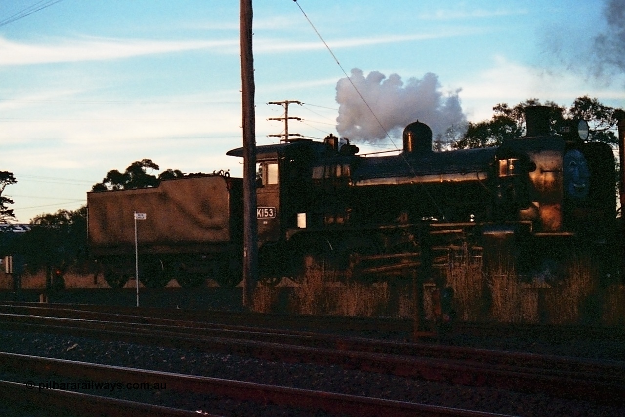 115-16
Somerton, Steamrail broad gauge K class K 153 Victorian Railways built Consolidation model 2-8-0 steam locomotive on the Upfield with an enthusiasts special, about to cross Somerton Road, Steamrail special, looking across the North East running lines, Blue Circle location post, dwarf electric colour light shunting signals 11 for the SG line and 6 for the BG line.
Keywords: K-class;K153;Victorian-Railways-Newport-WS;Consolidation;2-8-0;