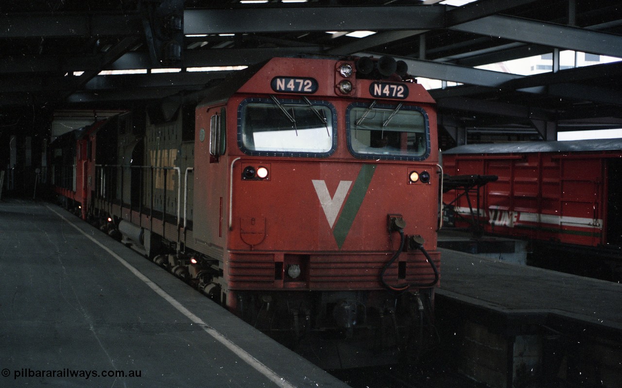 116-02
Spencer Street Station Platform No.2, V/Line broad gauge N class locos N 472 Clyde Engineering EMD model JT22HC-2 serial 87-1201 City of Sale and a sister have cut off 'The Overland' overnight train from Adelaide and idle away in the dock as the yard pilot shunts off the Motorail waggons.
Keywords: N-class;N472;Clyde-Engineering-Somerton-Victoria;EMD;JT22HC-2;87-1201;