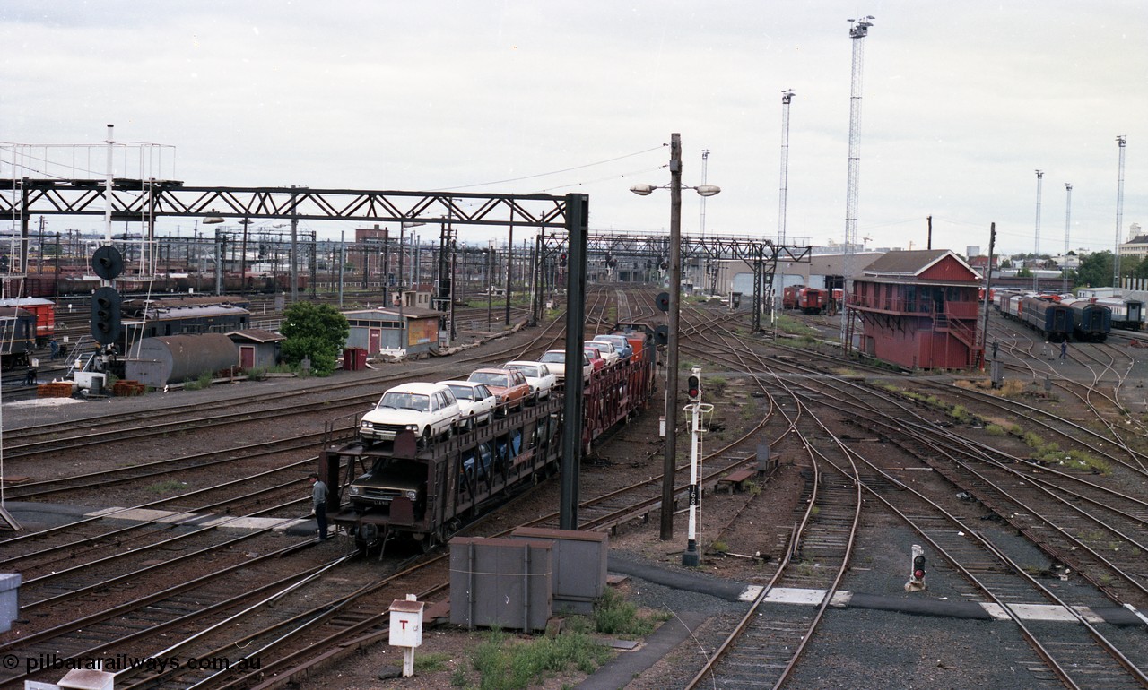 116-11
Spencer Street Station, view looking west from flyover, V/Line broad gauge Y class pilot Y 151 Clyde Engineering EMD model G6B serial 67-571 shunts the 'The Overland' Motorail waggons, DERM 54 RM at left, West Tower in the middle background, Spencer Street No.1 Signal Box at right with broad gauge passenger stabling and maintenance sidings behind it, track work, points, searchlight signals and gantries and shunting signals, shunter riding waggon.
Keywords: Y-class;Y151;Clyde-Engineering-Granville-NSW;EMD;G6B;67-571;