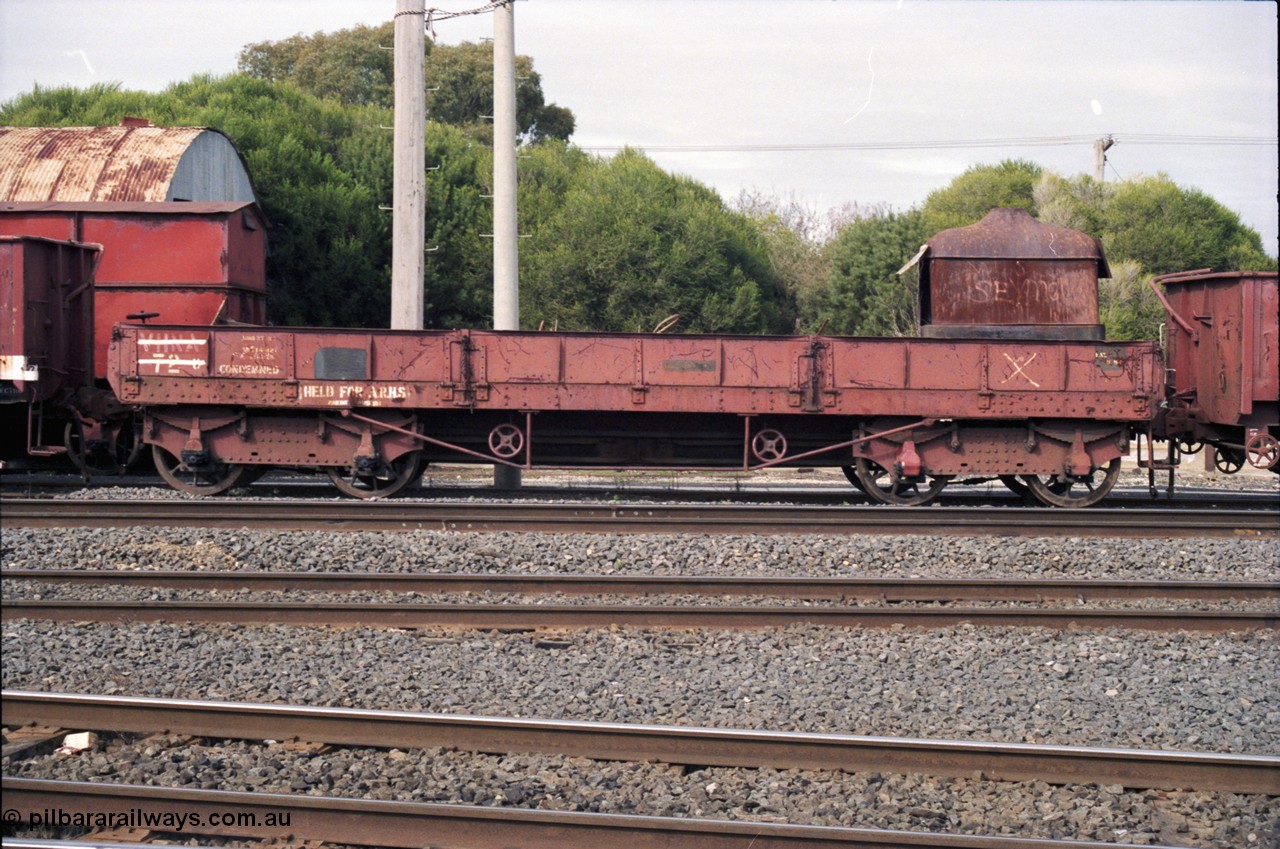 117-13
Benalla, stored broad gauge waggons, VHNA type bogie ballast waggon with plate frame bogies VHNA 72, stencilled 'Held for ARHS'. Built by Newport Workshops in June 1913 at QN type, in February 1981 recoded to VHNA type and placed off register in May 1984. 
Keywords: VHNA-type;VHNA72;Victorian-Railways-Newport-WS;QN-type;