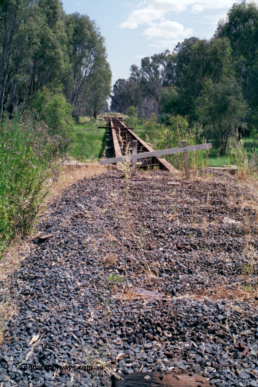 118-17
Tocumwal line, view of third bridge, deck removed, looking south, track removed, line out of service. [url=https://goo.gl/maps/SBYc5kCqFAEzEqjg7]Geo data[/url].
