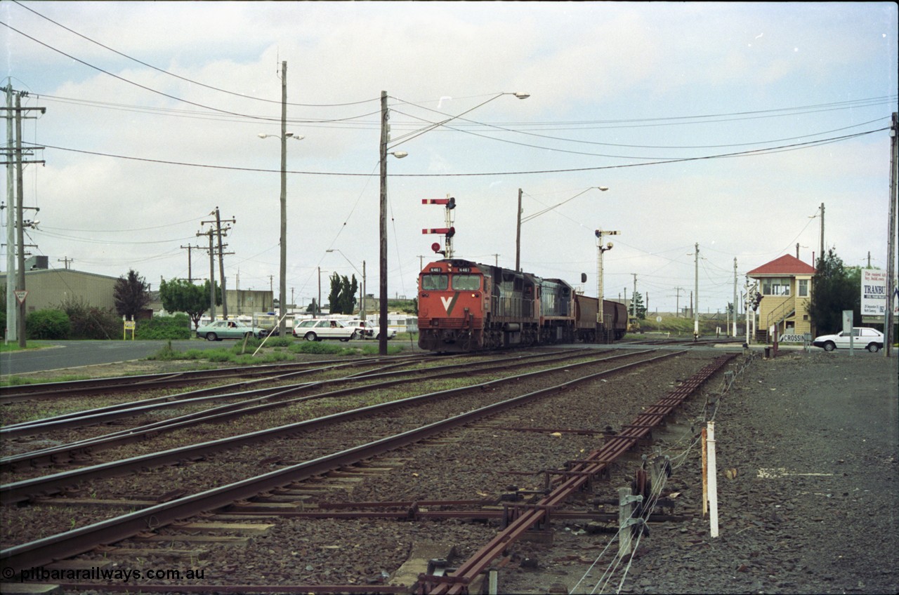 119-00
Nth Geelong C Box, V/Line broad gauge locos N class N 461 'City of Ararat' Clyde Engineering EMD model JT22HC-2 serial 86-1190 and X class X 47 Clyde Engineering EMD model G26C serial 75-794 work an empty grain train onto the mainline to Gheringhap from the Nth Geelong grain loop, crossing Separation Street, semaphore signals, point rodding and signal box.
Keywords: N-class;N461;Clyde-Engineering-Somerton-Victoria;EMD;JT22HC-2;86-1190;