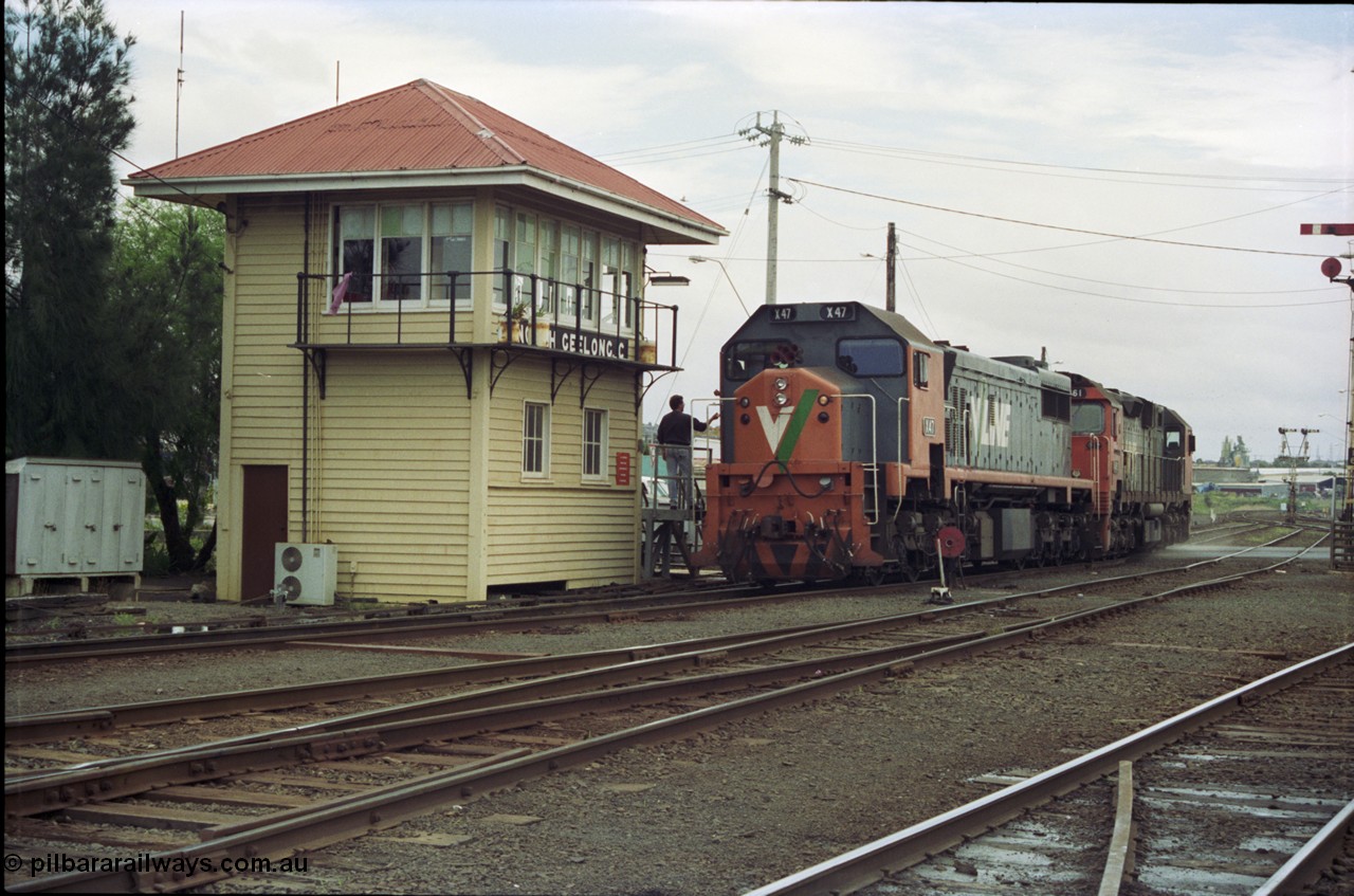 119-04
Nth Geelong C Box, V/Line broad gauge light locos X class X 47 Clyde Engineering EMD model G26C serial 75-794 and N class N 461 'City of Ararat' Clyde Engineering EMD model JT22HC-2 serial 86-1190 collect the electric staff for the Nth Geelong B Box section, bound for Geelong loco depot after finishing grain loop unloading duties.
Keywords: X-class;X47;Clyde-Engineering-Rosewater-SA;EMD;G26C;75-794;