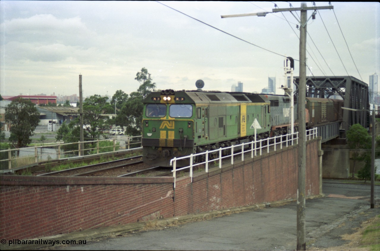 119-14
Maribyrnong River, Bunbury St Tunnel, Australian National broad gauge loco BL class BL 31 Clyde Engineering EMD model JT26C-2SS serial 83-1015 and V/Line C class C 509 Clyde Engineering EMD model GT26C serial 76-832 work down Adelaide goods train 9149 over the Maribyrnong River.
Keywords: BL-class;BL31;Clyde-Engineering-Rosewater-SA;EMD;JT26C-2SS;83-1015;