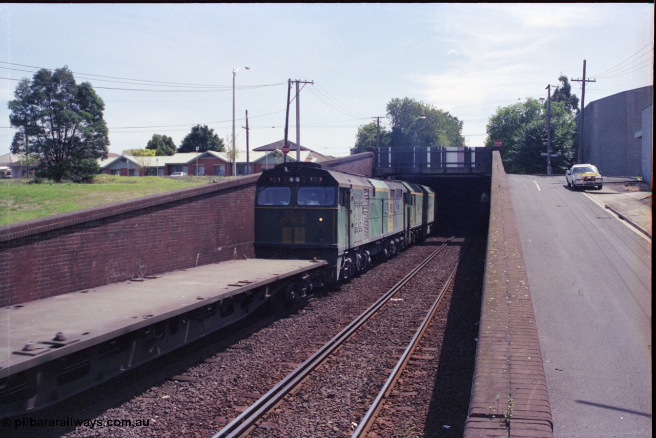 119-24
Bunbury Street Tunnel, Australian National broad gauge locos BL class BL 29 Clyde Engineering EMD model JT26C-2SS serial 83-1013 and 700 class 703 AE Goodwin ALCo model DL500G serial G6059-1 working down Adelaide bound goods train 9145 about to enter the tunnel, trailing view.
Keywords: 700-class;703;AE-Goodwin;ALCo;DL500G;G6059-1;