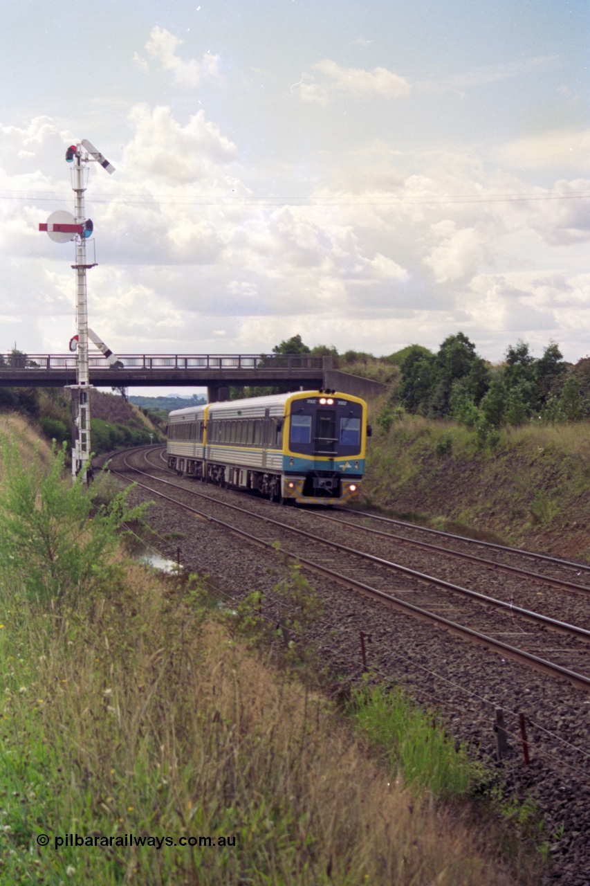 119-33
Warrenheip, V/Line broad gauge Sprinter 7002 and a sister, built by Goninan NSW as LDRPV class in 1993 with an 88 passenger capacity, work an up Ballarat passenger train past semaphore signal post 11.
Keywords: Sprinter;Goninan-NSW;LDRPV-class;7002;