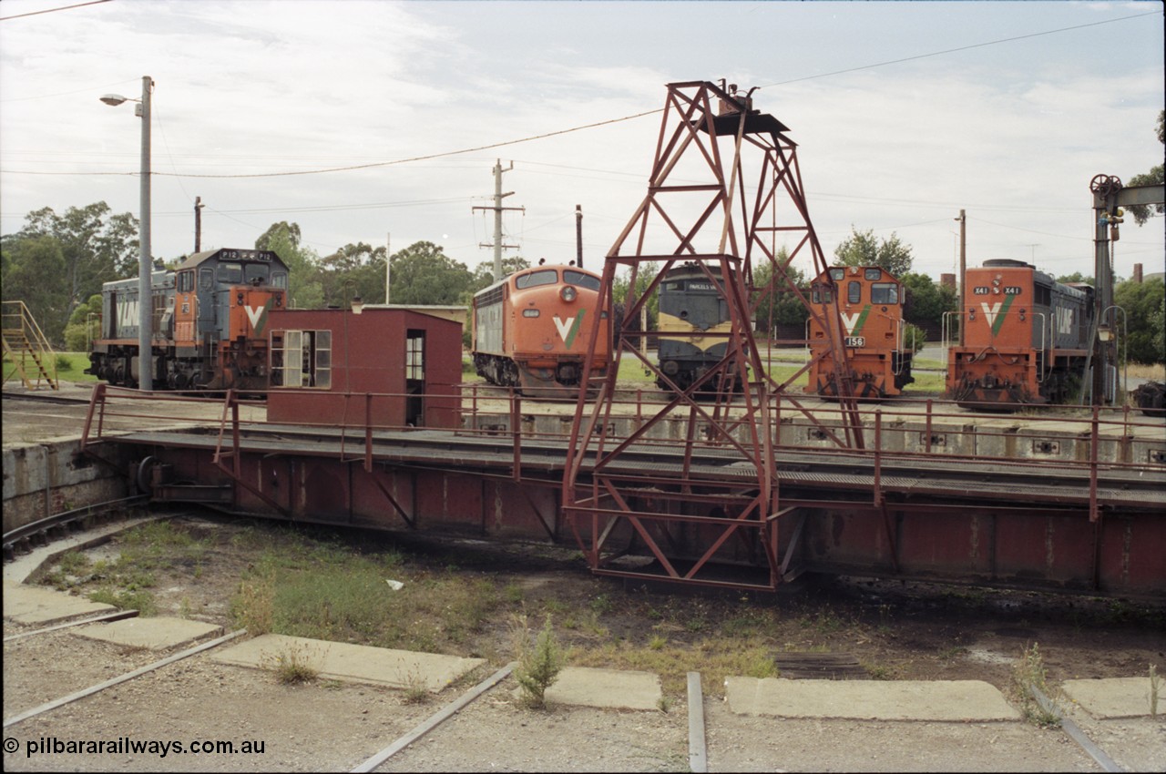 120-11
Seymour loco depot, turntable and pit, V/Line broad gauge locos, P class P 12 Clyde Engineering EMD model G18HBR serial 84-1206 rebuilt from T 329 Clyde Engineering EMD model G8B serial 56-82, B class B 64 Clyde Engineering EMD model ML2 serial ML2-5, CM class CM 3 parcels van, Y class Y 156 Clyde Engineering EMD model G6B serial 67-576 and X class X 41 Clyde Engineering EMD model G26C serial 70-704.
Keywords: P-class;P12;Clyde-Engineering-Somerton-Victoria;EMD;G18HBR;84-1206;