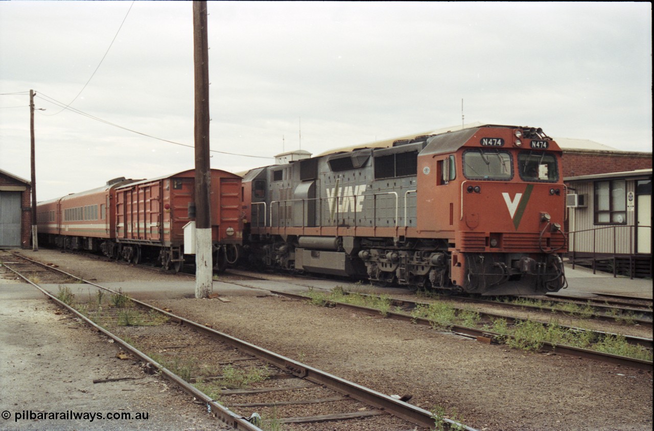120-30
Wodonga yard, stabled passenger consists, V/Line broad gauge loco N class N 474 'City of Traralgon' Clyde Engineering EMD model JT22HC-2 serial 87-1203, next to a D van.
Keywords: N-class;N474;Clyde-Engineering-Somerton-Victoria;EMD;JT22HC-2;87-1203;