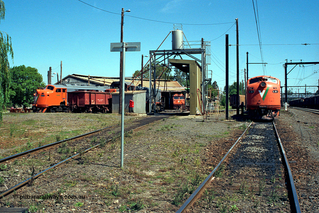 122-09
Traralgon loco depot overview, looking west from east end, sanding tower and fuel point, A class Clyde Engineering EMD model AAT22C-2R, HD waggon for sand transport and storage, T class Clyde Engineering EMD model G8B, G class Clyde Engineering EMD model JT26C-2SS, S class S 317 'Sir John Monash' Clyde Engineering EMD model A7 serial 61-240.
Keywords: S-class;S317;Clyde-Engineering-Granville-NSW;EMD;A7;61-240;bulldog;