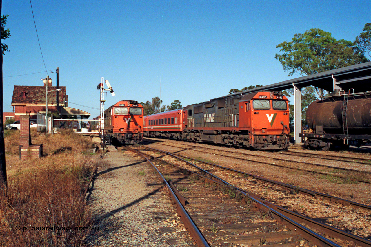 123-1-10
Bairnsdale station overview, V/Line broad gauge N class leader N 451 'City of Portland' Clyde Engineering EMD model JT22HC-2 serial 85-1219 with an up passenger train and N class N 452 'Rural City of Wodonga' serial 85-1220 with a stabled pass in the yard, signal post, VTQF type tank waggon VTQF 144.
Keywords: N-class;N451;Clyde-Engineering-Somerton-Victoria;EMD;JT22HC-2;85-1219;VTQF-type;VTQF144;
