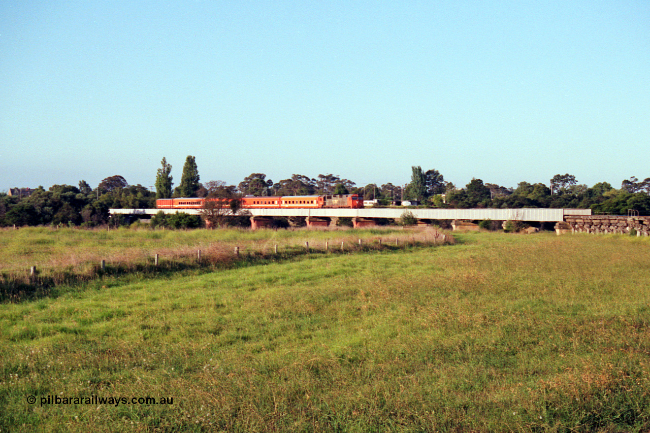 123-1-14
Avon River steel bridge, trestle bridge over flood plain at right, V/Line broad gauge N class N 451 'City of Portland' Clyde Engineering EMD model JT22HC-2 serial 85-1219 N set, up Bairnsdale pass, distant shot.
Keywords: N-class;N451;Clyde-Engineering-Somerton-Victoria;EMD;JT22HC-2;85-1219;