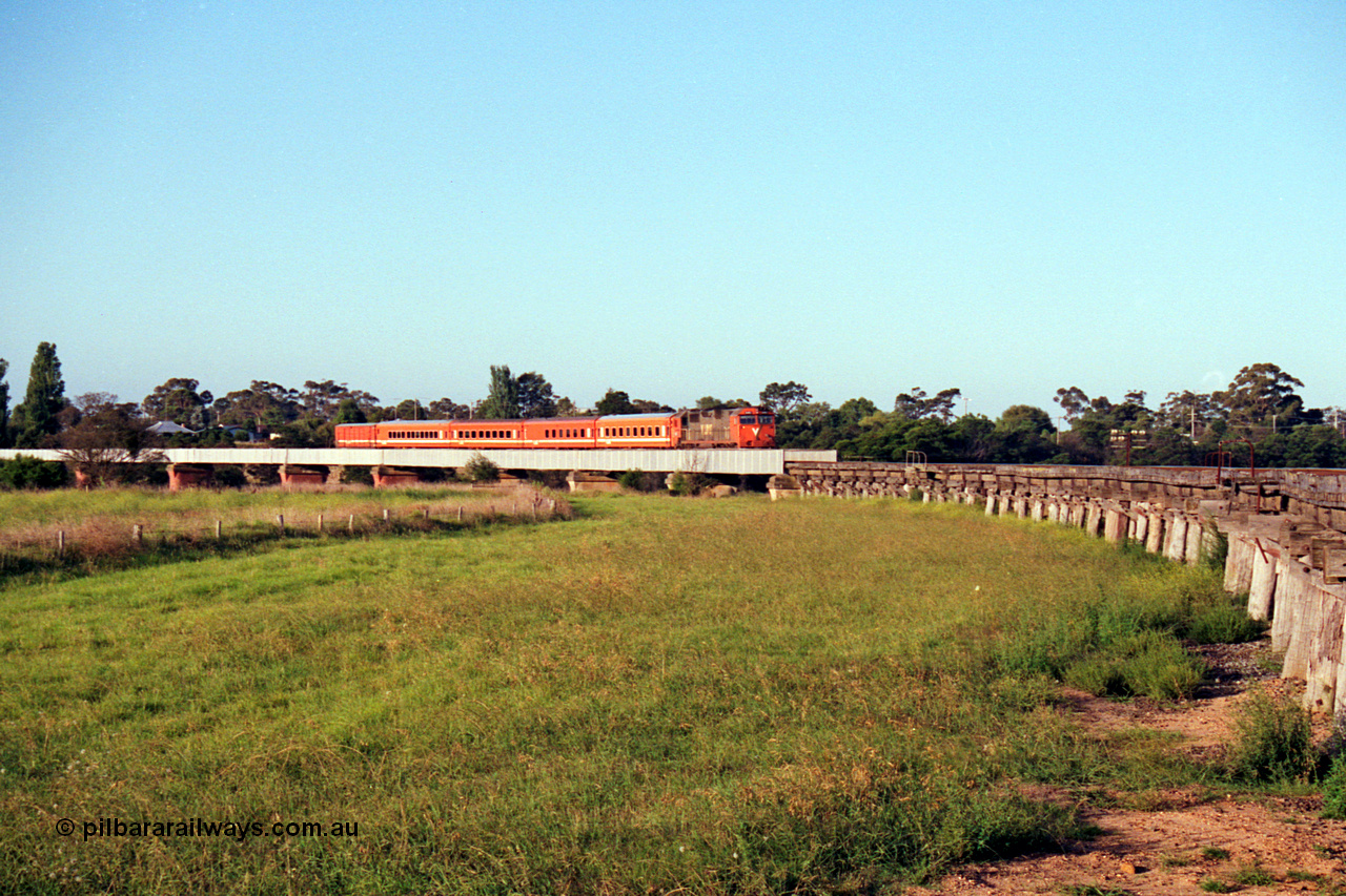 123-1-15
Avon River steel bridge, trestle bridge over flood plain at right, V/Line broad gauge N class N 451 'City of Portland' Clyde Engineering EMD model JT22HC-2 serial 85-1219 N set, up Bairnsdale pass, distant shot.
Keywords: N-class;N451;Clyde-Engineering-Somerton-Victoria;EMD;JT22HC-2;85-1219;