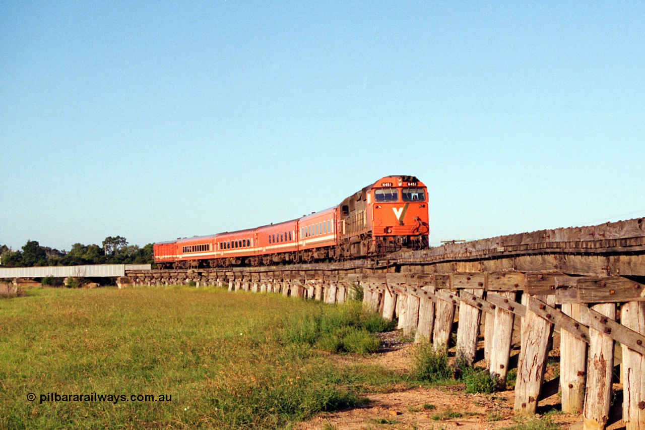 123-1-18
Avon River steel bridge, trestle bridge over flood plain at right, V/Line broad gauge N class N 451 'City of Portland' Clyde Engineering EMD model JT22HC-2 serial 85-1219, N set, up Bairnsdale pass.
Keywords: N-class;N451;Clyde-Engineering-Somerton-Victoria;EMD;JT22HC-2;85-1219;