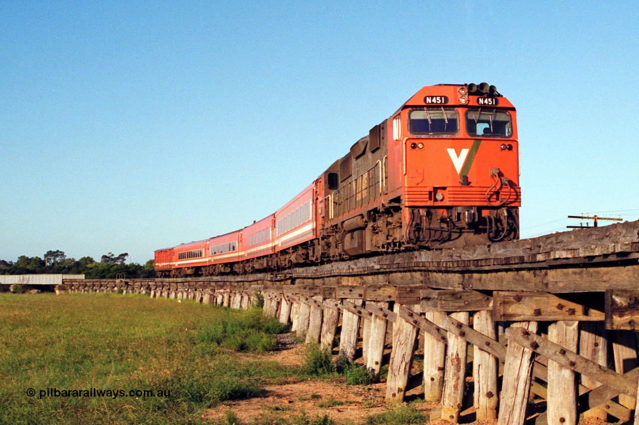 123-1-19
Avon River steel bridge at left, trestle bridge over flood plain, V/Line broad gauge N class N 451 'City of Portland' Clyde Engineering EMD model JT22HC-2 serial 85-1219, N set, up Bairnsdale pass.
Keywords: N-class;N451;Clyde-Engineering-Somerton-Victoria;EMD;JT22HC-2;85-1219;