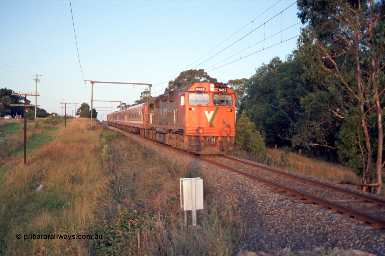 123-1-22
Traralgon, Coonoc Rd, V/Line broad gauge N class N 451 'City of Portland' Clyde Engineering EMD model JT22HC-2 serial 85-1219, N set, up Bairnsdale pass.
Keywords: N-class;N451;Clyde-Engineering-Somerton-Victoria;EMD;JT22HC-2;85-1219;