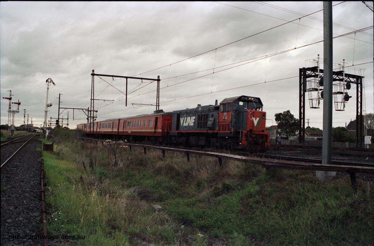 123-2-19
Sunshine V/Line broad gauge up passenger train with P class P 14 Clyde Engineering EMD model G18HBR serial 84-1208 rebuilt from First Series T class T 330 Clyde Engineering EMD model G8B serial 56-85, and H set, searchlight signal gantry on the right is for the standard gauge Sunshine Loop. Semaphore signal post 49 is pulled off for an up train on the Newport - Sunshine Loop Line on the left.
Keywords: P-class;P14;Clyde-Engineering-Somerton-Victoria;EMD;G18HBR;84-1208;rebuild;