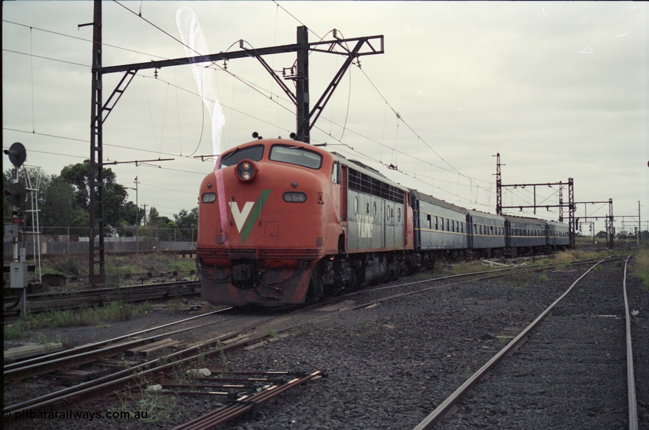123-2-27
Sunshine V/Line broad gauge down Bacchus Marsh passenger train with aging B class B 64 Clyde Engineering EMD model ML2 serial ML2-5 and blue coach set consisting of South Australian K type carriages, AK 1 (500), BK 1 (702), BKL 3 (600) and BK 2 (703).
Keywords: B-class;B64;Clyde-Engineering-Granville-NSW;EMD;ML2;ML2-5;bulldog;