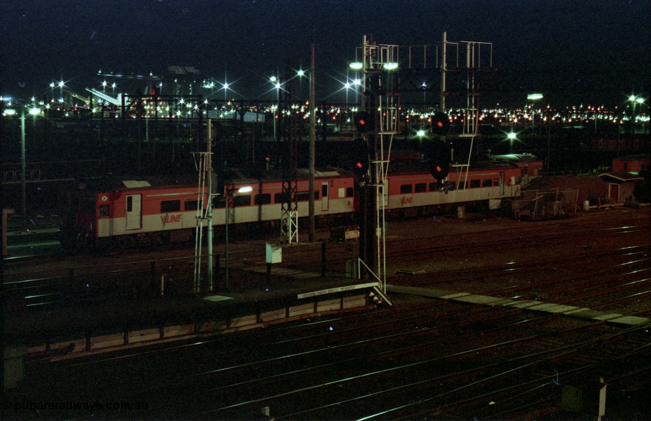 123-2-32
Spencer Street Station yard view, night shot, rail motor storage tracks, 3 broad gauge V/Line DRC class units.
Keywords: DRC-class;Tulloch-Ltd-NSW;