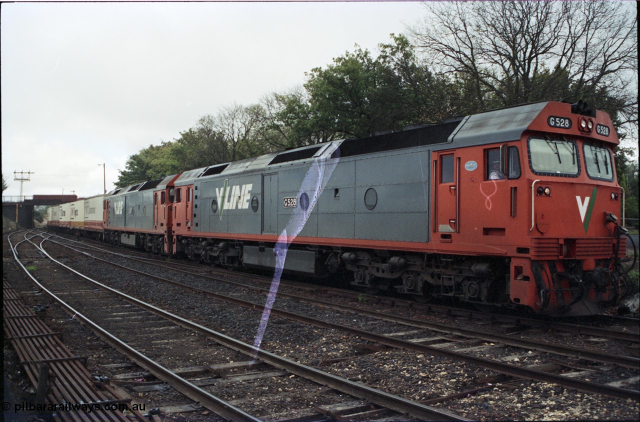 123-2-35
Ballarat, Lydiard Street, V/Line broad gauge G classes G 528 Clyde Engineering EMD model JT26C-2SS serial 88-1258 and G 533 Clyde Engineering EMD model JT26C-2SS serial 88-1263 with up Adelaide goods train 9150.
Keywords: G-class;G528;Clyde-Engineering-Somerton-Victoria;EMD;JT26C-2SS;88-1258;