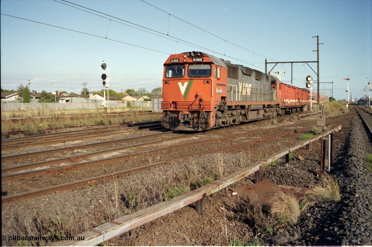 124-06
Sunshine V/Line broad gauge down passenger service with N class N 466 Clyde Engineering EMD model JT22HC-2 serial 86-1195 'City of Warrnambool' and D vans and N set, standard gauge Sunshine Loop up home signal on the far left, Newport Loop Line on the right.
Keywords: N-class;N466;Clyde-Engineering-Somerton-Victoria;EMD;JT22HC-2;86-1195;