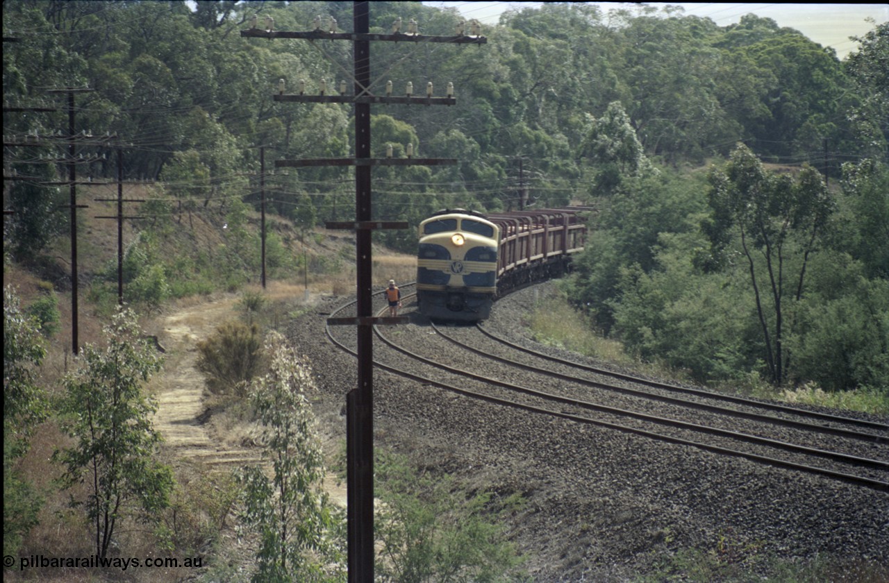 125-13
Kilmore East V/Line broad gauge B class 65 Clyde Engineering EMD model ML2 serial ML2-6 still in Victorian Railways livery leads a sleeper discharge train on the up broad gauge line, ganger walking line.
Keywords: B-class;B65;Clyde-Engineering-Granville-NSW;EMD;ML2;ML2-6;bulldog;