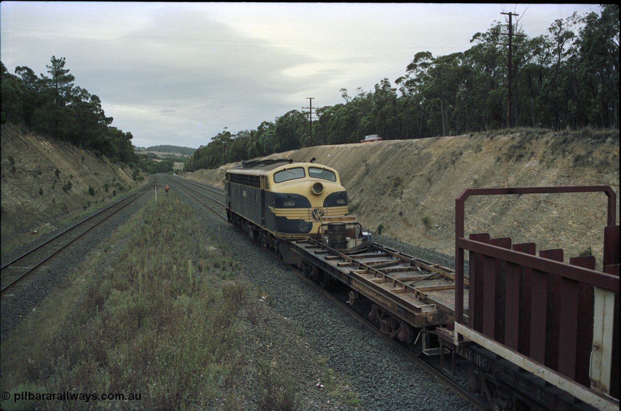 125-21
Heathcote Junction, V/Line broad gauge B class Clyde Engineering EMD model ML2 serial ML2-6 still in Victorian Railways livery leads a sleeper discharge train on the up broad gauge line, rolling down toward Wallan, V/Line VZCA class waggon.
Keywords: B-class;B65;Clyde-Engineering-Granville-NSW;EMD;ML2;ML2-6;bulldog;