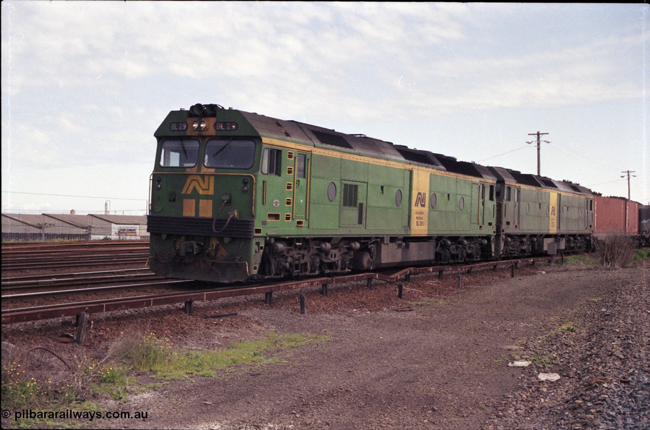 126-03
Tottenham yard, broad gauge Australian National BL class locos BL 29 Clyde Engineering EMD model JT26C-2SS serial 83-1013 and BL 31 serial 83-1015 lead up Adelaide goods train 9150 into Tottenham yard, taken from standard gauge line.
Keywords: BL-class;BL29;Clyde-Engineering-Rosewater-SA;EMD;JT26C-2SS;83-1013;