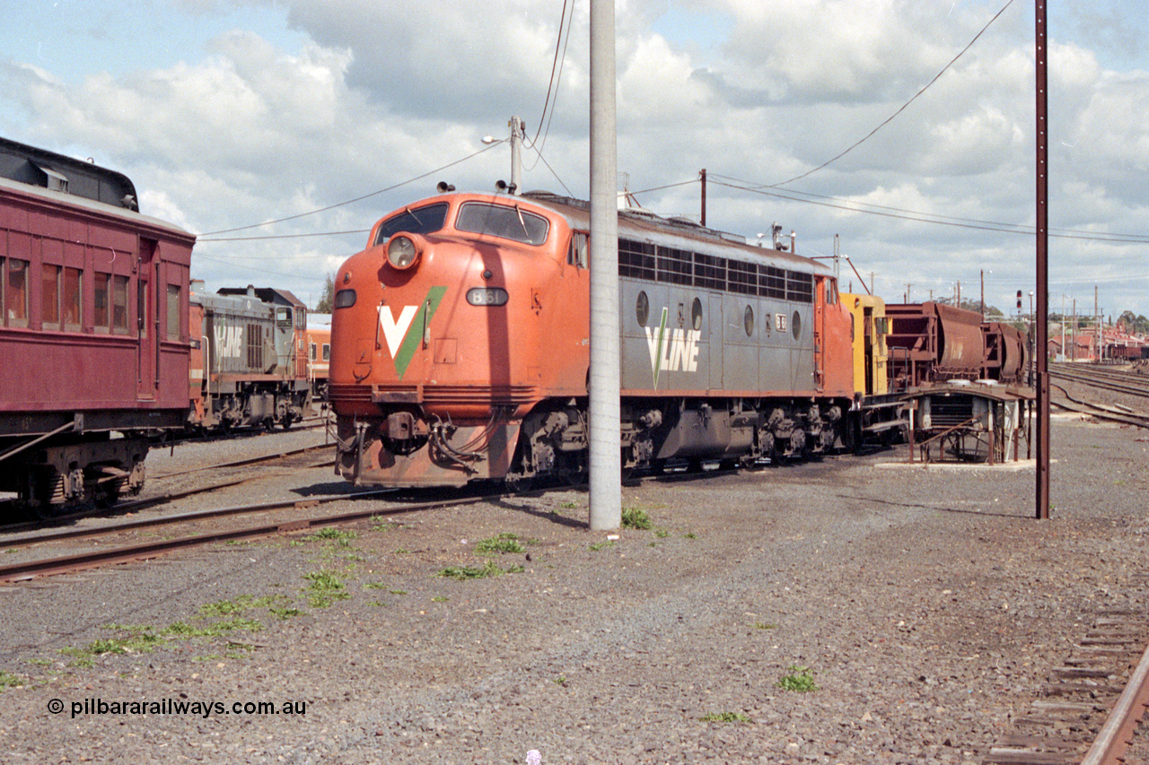 127-04
Seymour loco depot, V/Line B class B 61 Clyde Engineering EMD model ML2 serial ML2-2, Rail Tractor RT class member RT 40 and ballast waggons in view.
Keywords: B-class;B61;Clyde-Engineering-Granville-NSW;EMD;ML2;ML2-2;bulldog;