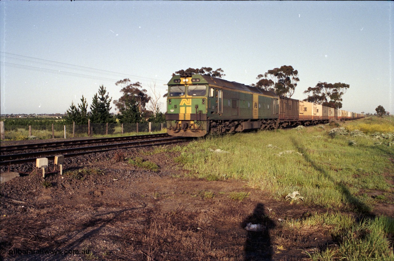 127-19
Deer Park West, broad gauge Australian National BL class BL 31 Clyde Engineering EMD model JT26C-2SS serial 83-1015 in AN livery leads an up goods train into Melbourne on the double track.
Keywords: BL-class;BL31;Clyde-Engineering-Rosewater-SA;EMD;JT26C-2SS;83-1015;