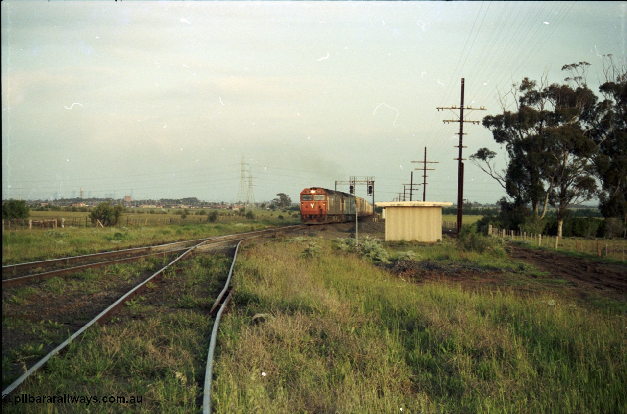 127-26
Deer Park West, view looking to Melbourne from the broad gauge line to Boral Quarries, with Adelaide bound goods pulling on to the main line at the end of the double track behind V/Line G class G 512 Clyde Engineering EMD model JT26C-2SS serial 84-1240 and Australian National BL class BL 27 Clyde Engineering EMD model JT26C-2SS serial 83-1011
Keywords: G-class;G512;Clyde-Engineering-Rosewater-SA;EMD;JT26C-2SS;84-1240;