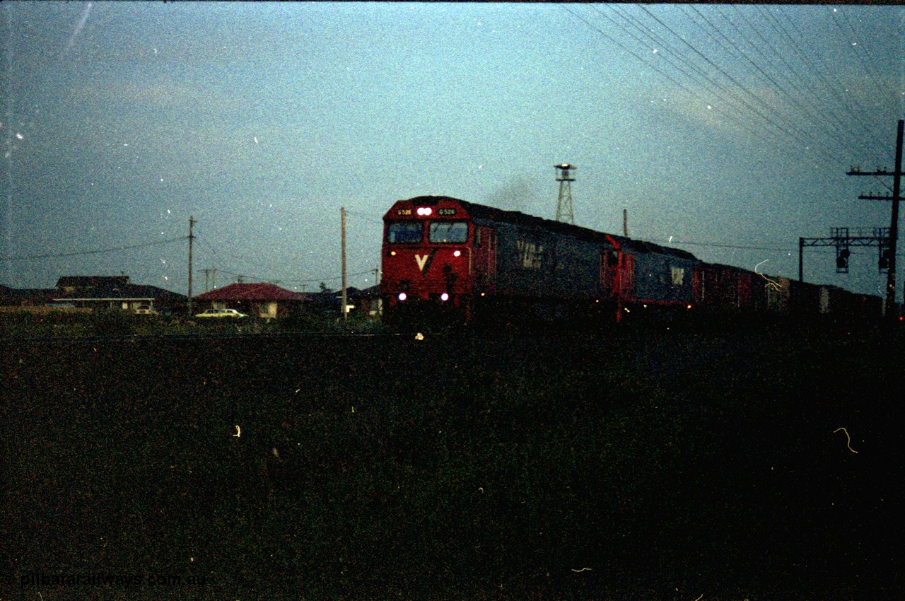 127-30
Deer Park West, broad gauge V/Line G class G 526 Clyde Engineering EMD model JT26C-2SS serial 88-1256 leads another G class with a down Adelaide goods train as it crosses Robinson's Road, very dark.
Keywords: G-class;G526;Clyde-Engineering-Somerton-Victoria;EMD;JT26C-2SS;88-1256;