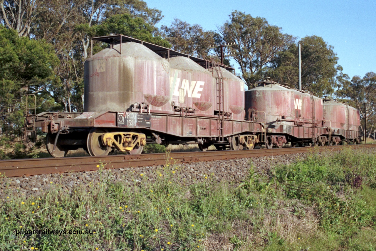 129-1-11
Lyndhurst, V/Line broad gauge VPCX type bogie air discharge cement hopper waggons VPCX 158, shows two styles of roof platforms. VPCX 158 is the final member of a batch of fifty (109-158) built at Bendigo Workshops in 1981/82. Re-classed in 1996 to VPBX. Location is [url=https://goo.gl/maps/APmJrHjskZH4gvxa6]Geo Data[/url].
Keywords: VPCX-type;VPCX158;VPBX-type;